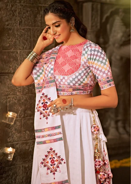 White with pink Lehenga with floral embroidery work in the skirt and blouse  with floral mirror border dupatta. – Meshira